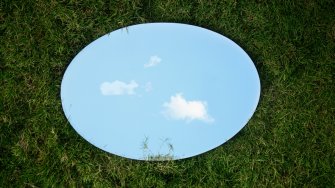  A round mirror on the grass
