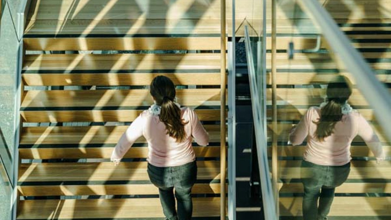 Student walking up stairs on Lahti Campus