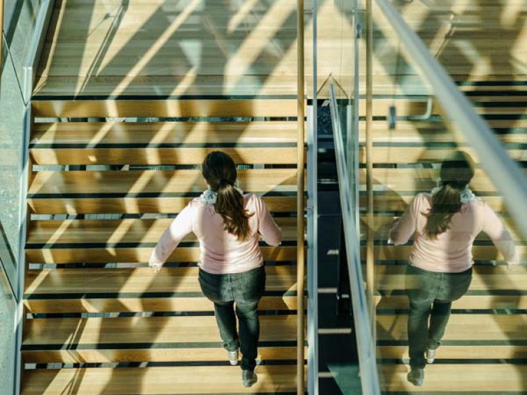 Student walking up stairs on Lahti Campus