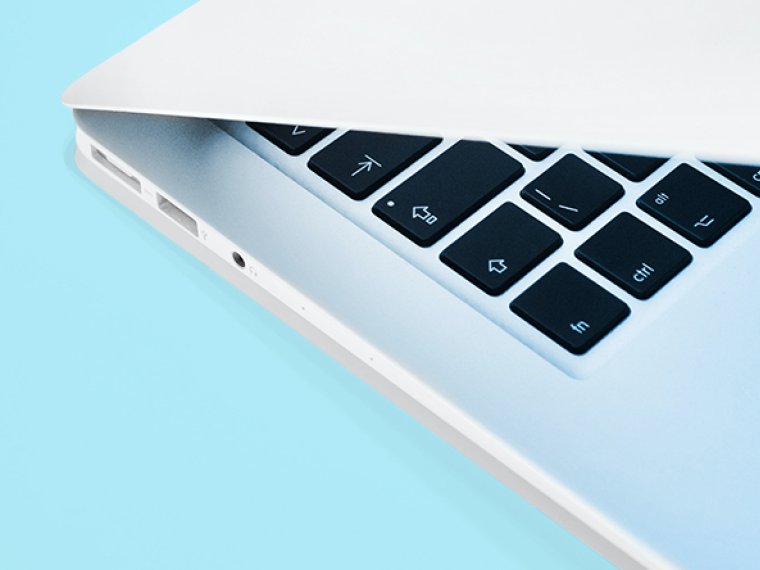 Laptop on a light blue background.